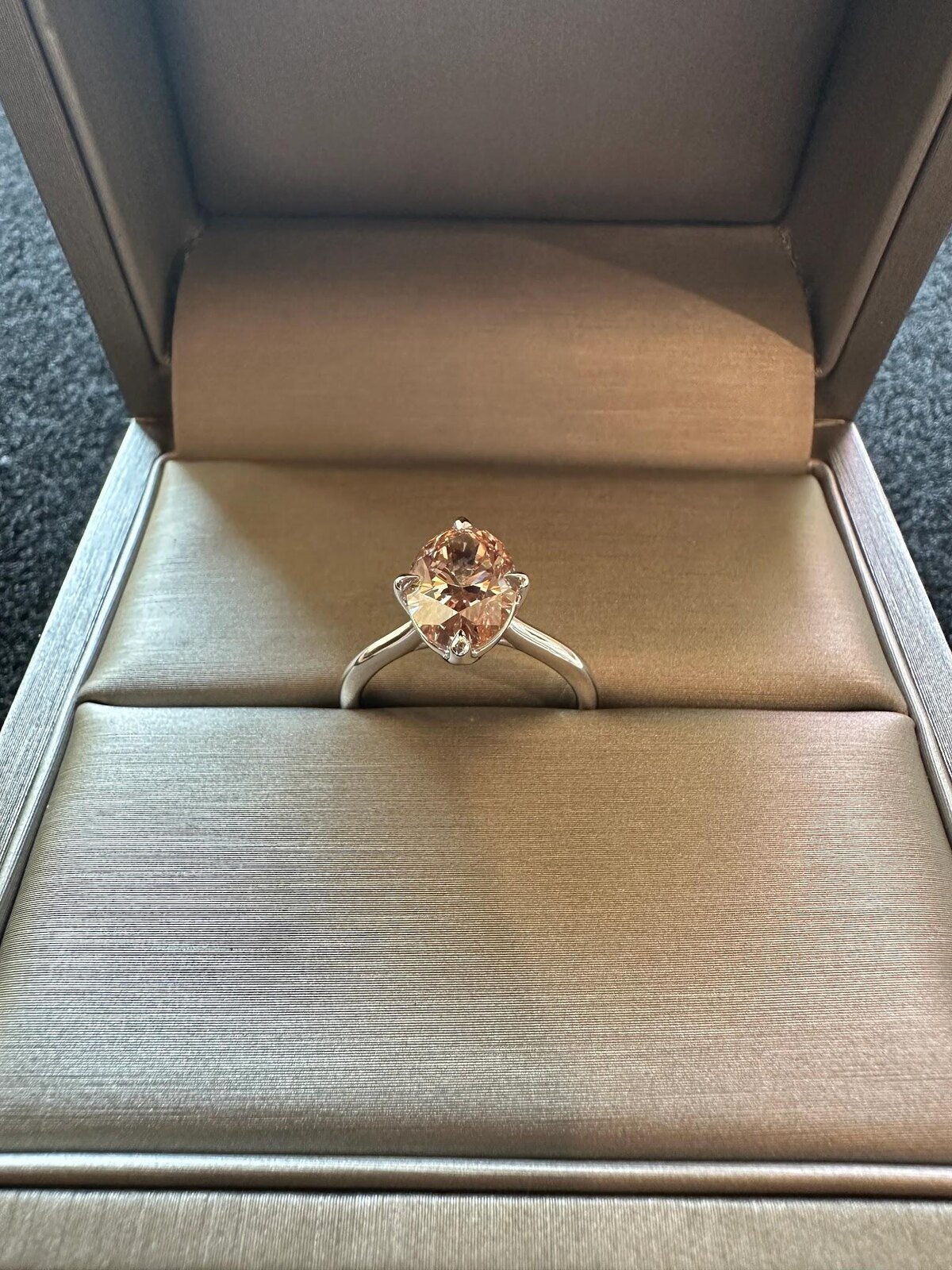 Custom engagement ring displayed in a jewelry box