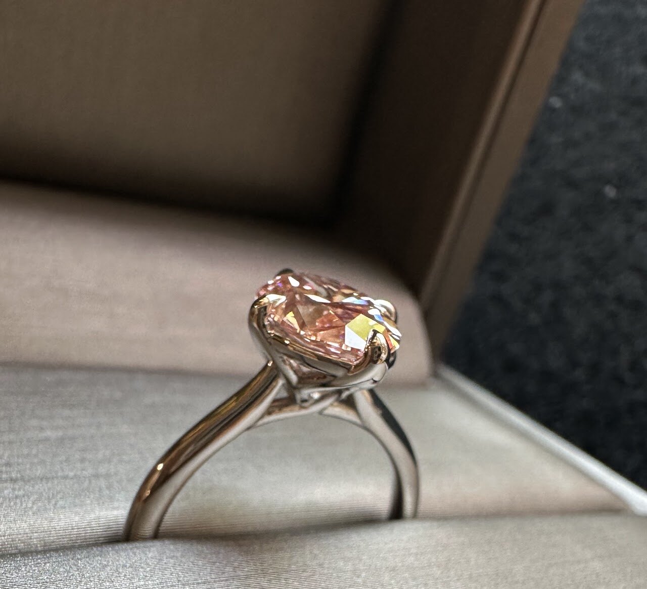 Oval warm-stone ring shown in a jewelry box