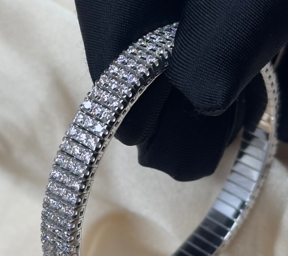Diamond bracelet detail on dark fabric