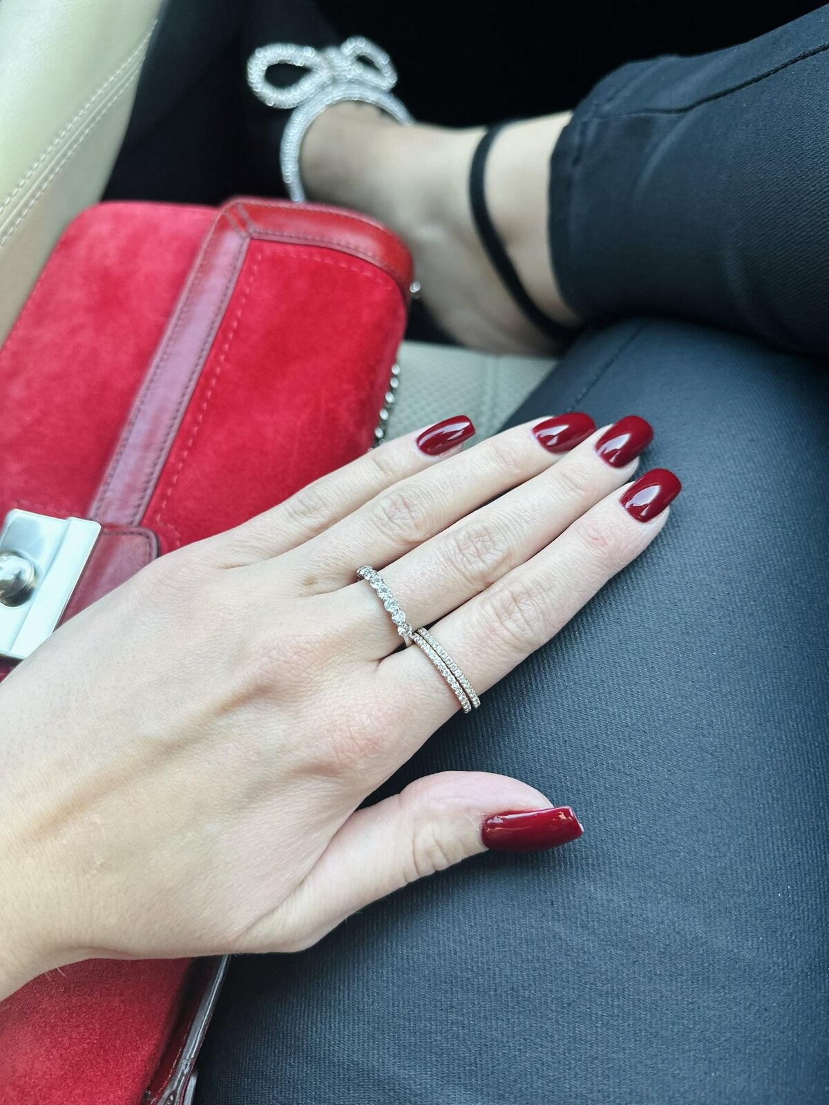 Engagement ring and wedding band worn during an everyday moment