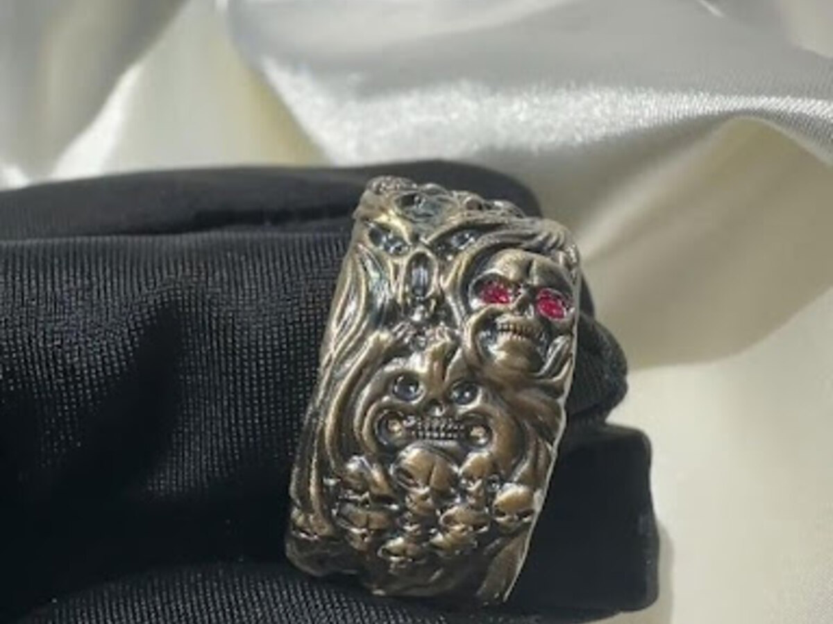 Bold custom skull ring with detailed metalwork