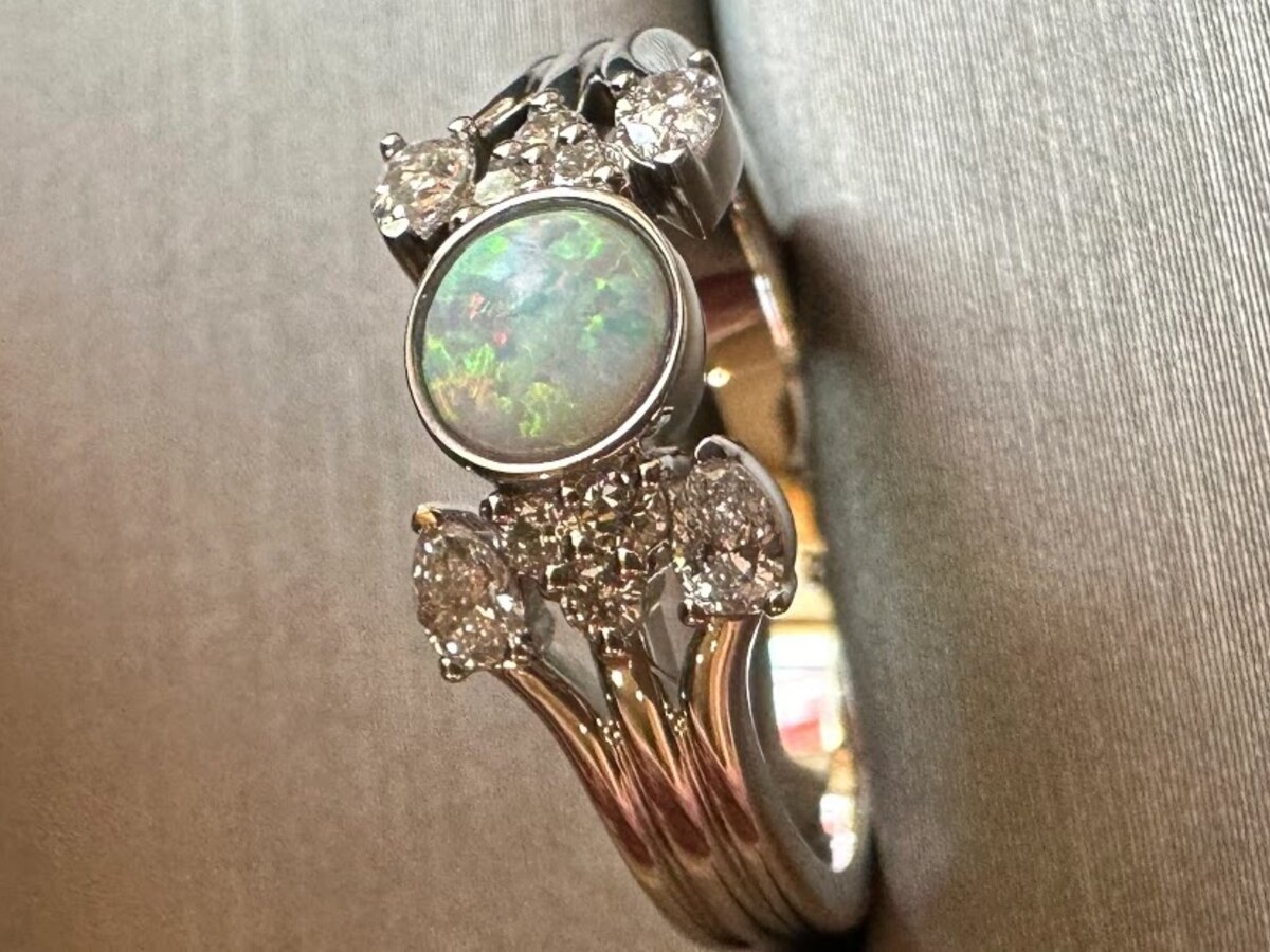 Detailed heirloom-style opal ring with ornate gold setting